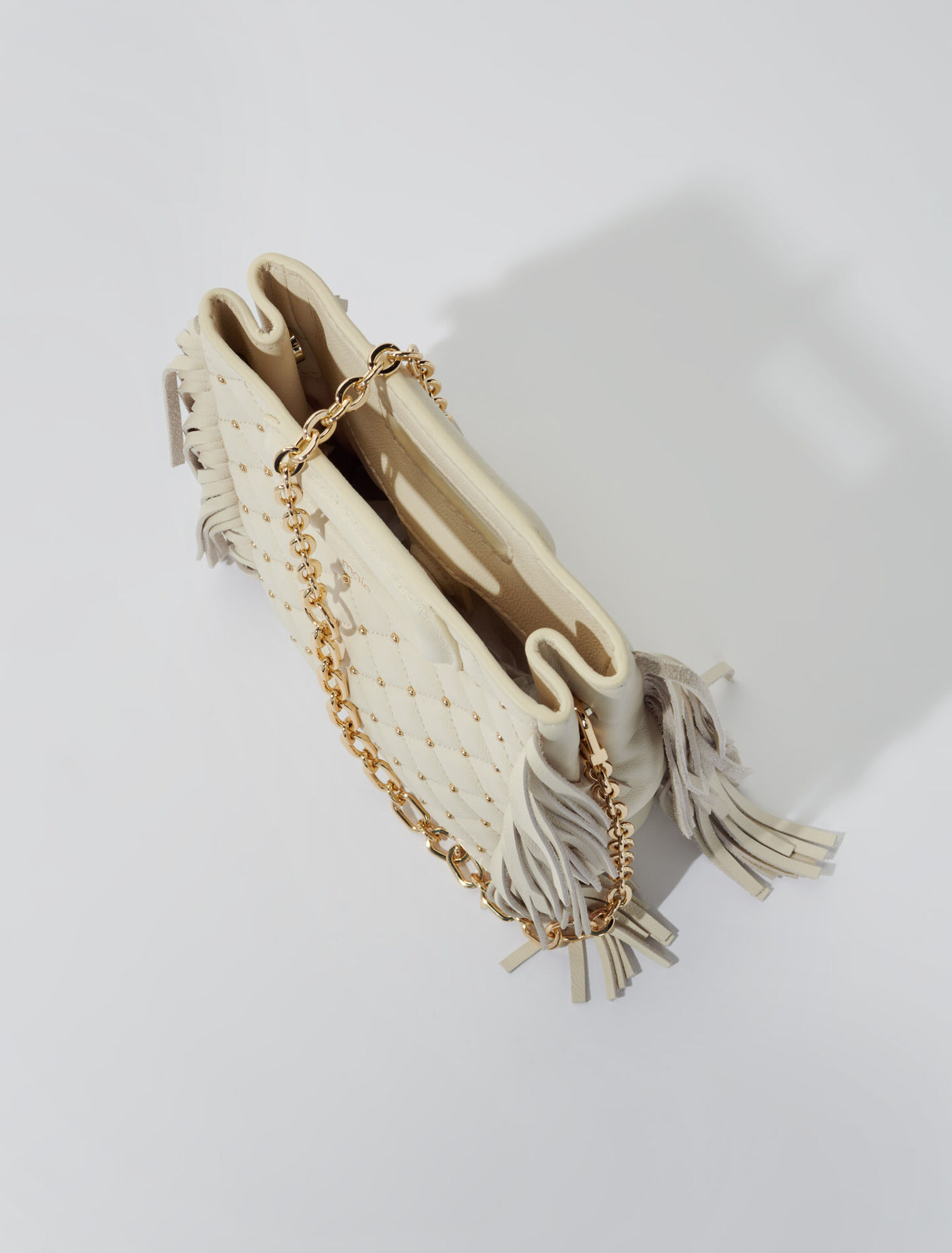 Studded M quilted leather mini bag