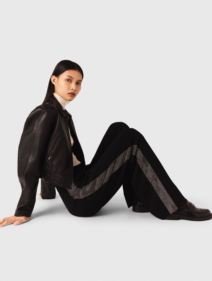 Trousers with rhinestone band