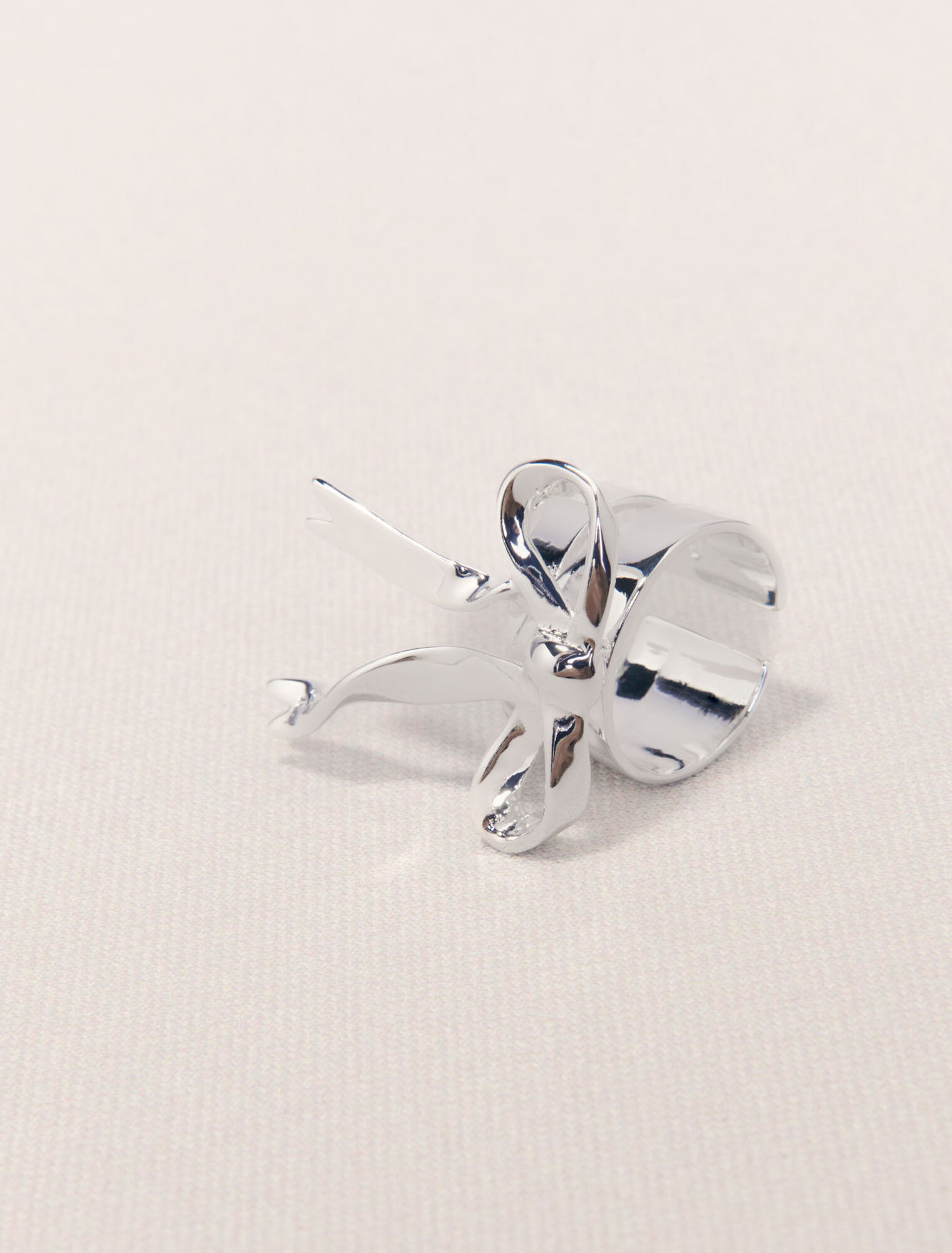 Open silver bow ring