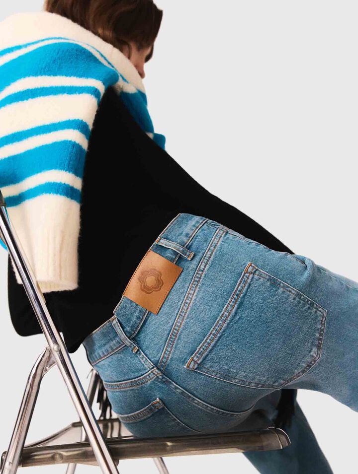 Flared jeans with chain