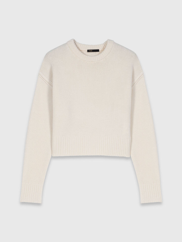 Jumper with floral brooch