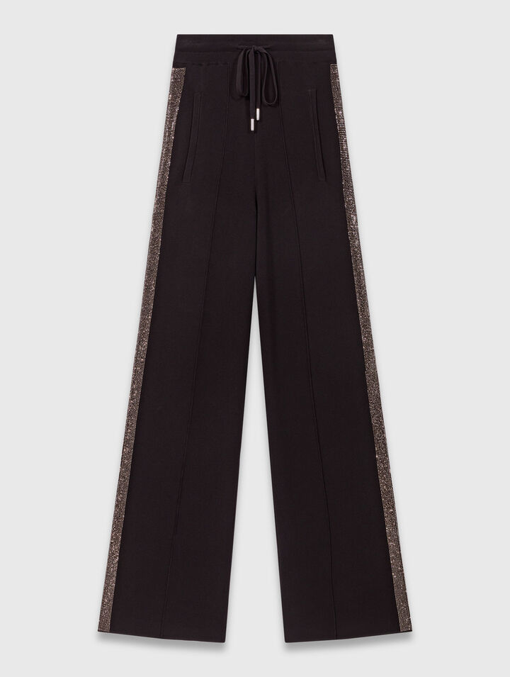 Trousers with rhinestone band