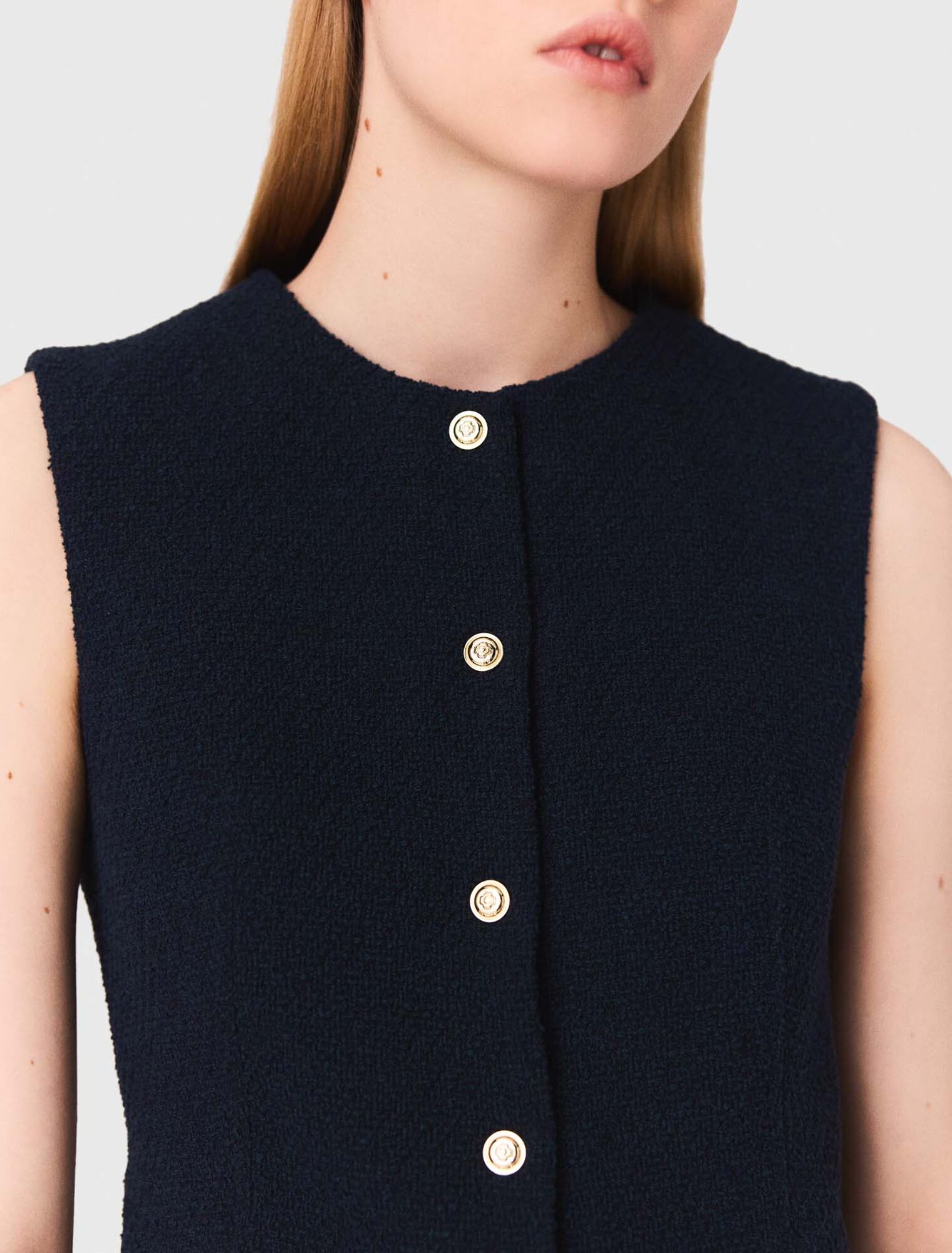 Long sleeveless tweed jacket