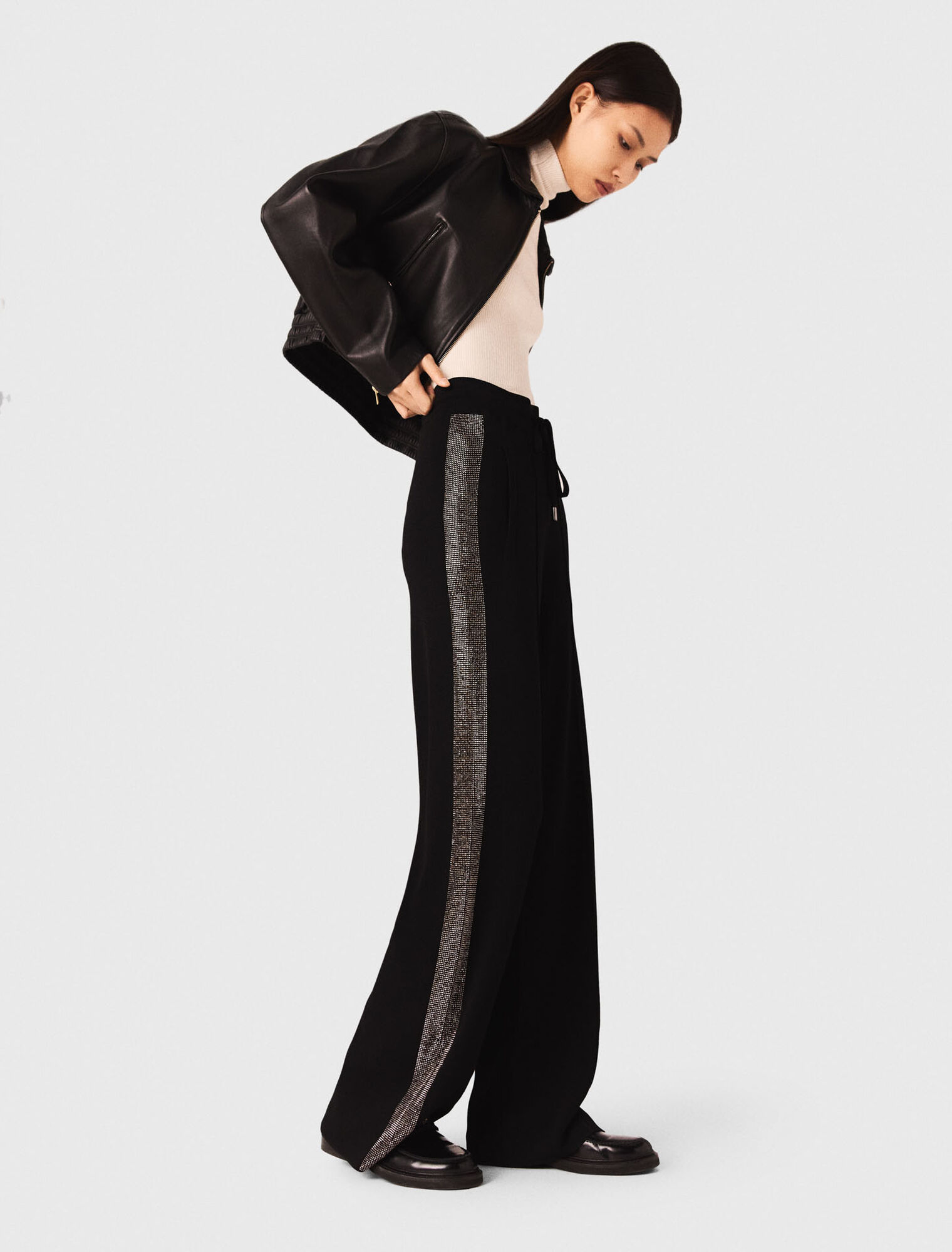 Trousers with rhinestone band