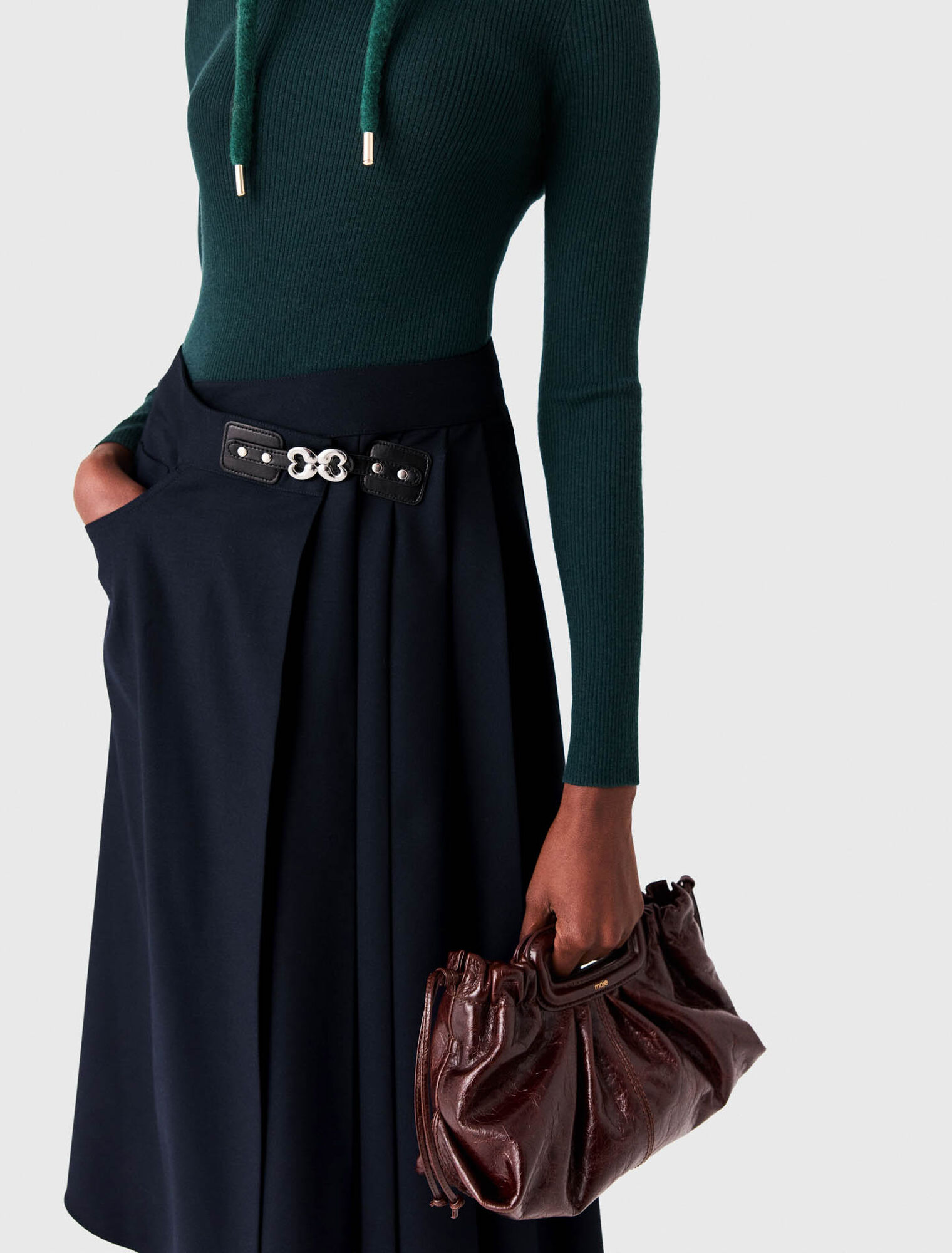 Long pleated skirt with buckle