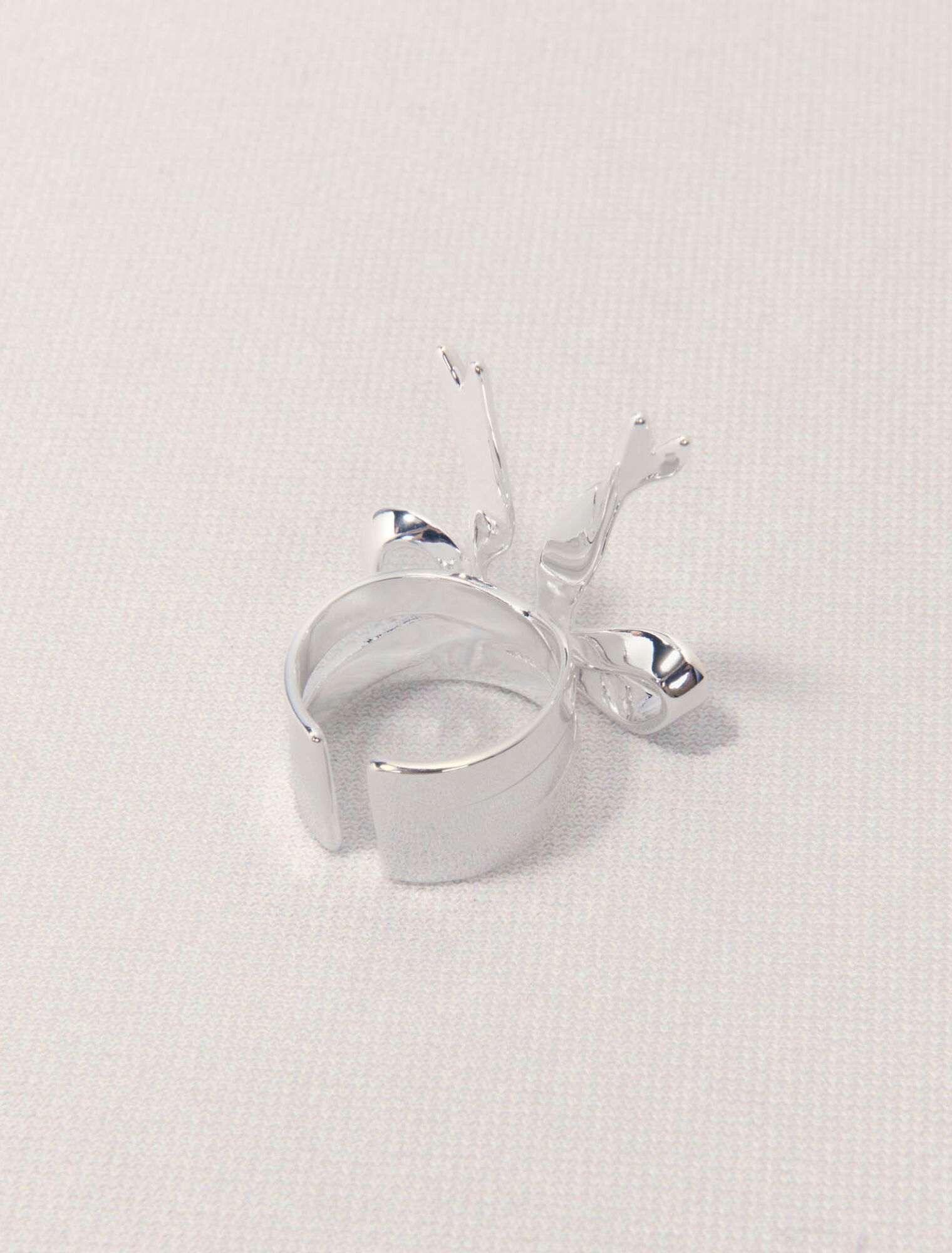 Open silver bow ring