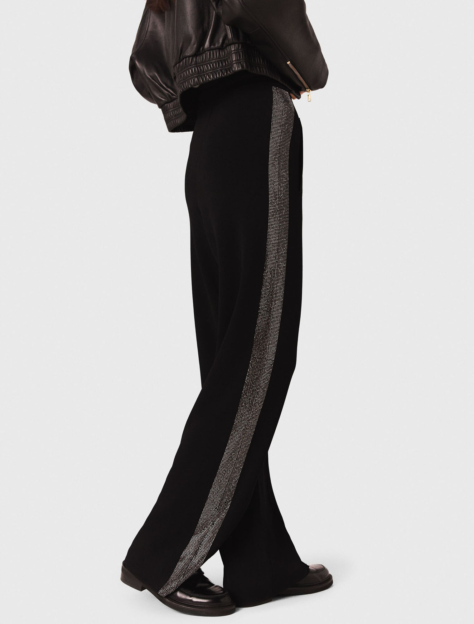 Trousers with rhinestone band