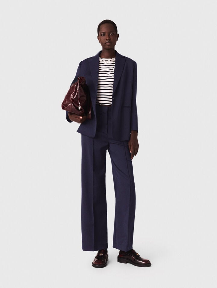 Suit jacket with pleated back