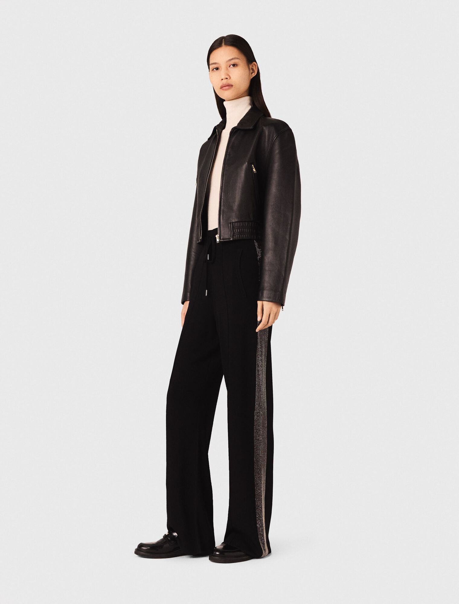 Trousers with rhinestone band