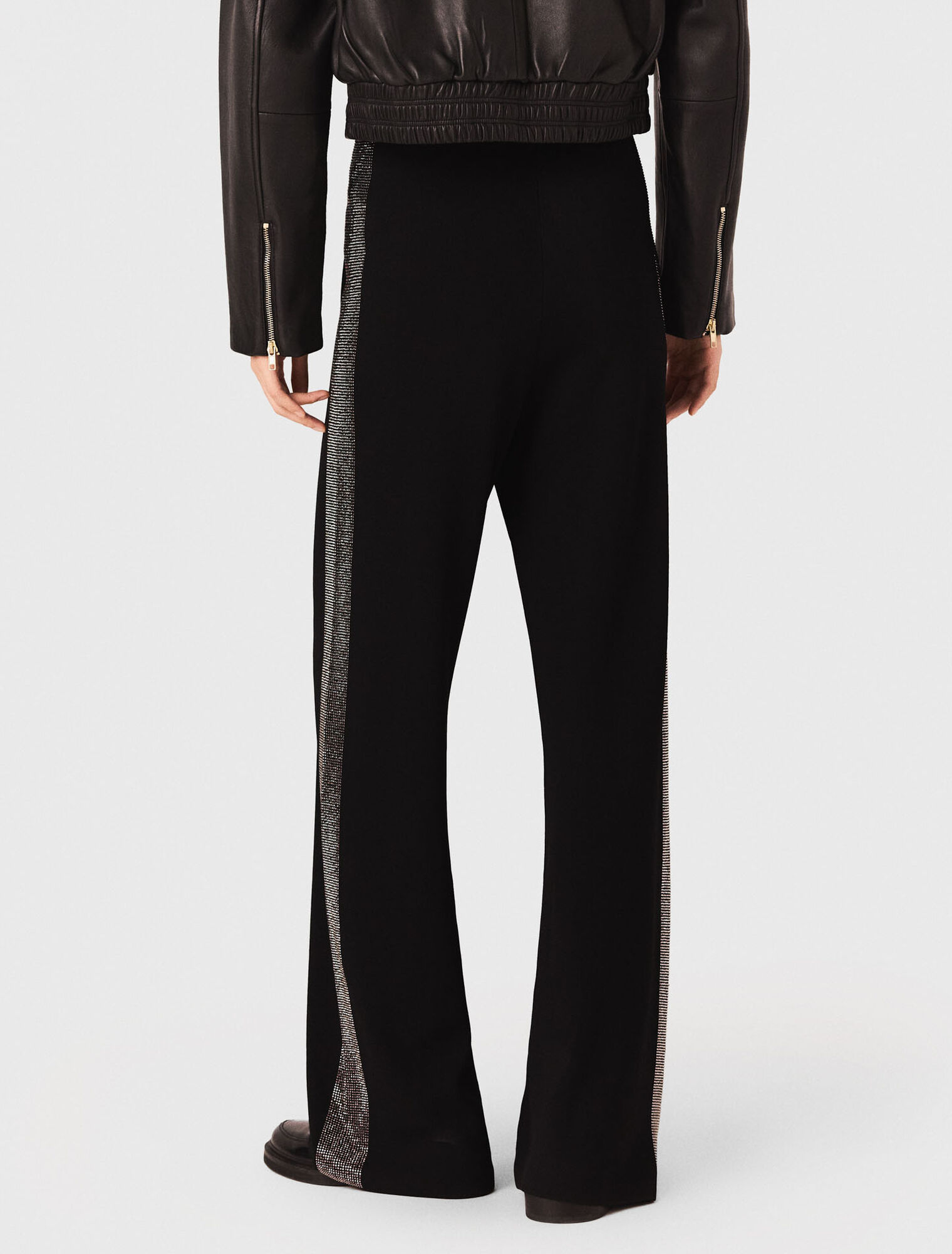 Trousers with rhinestone band
