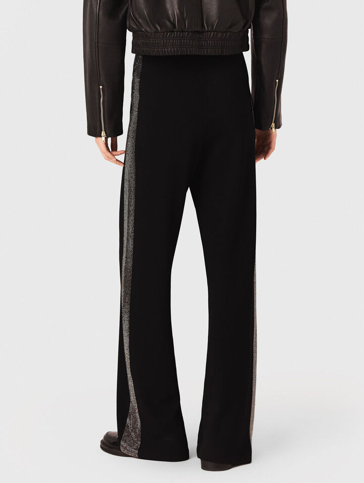 Trousers with rhinestone band