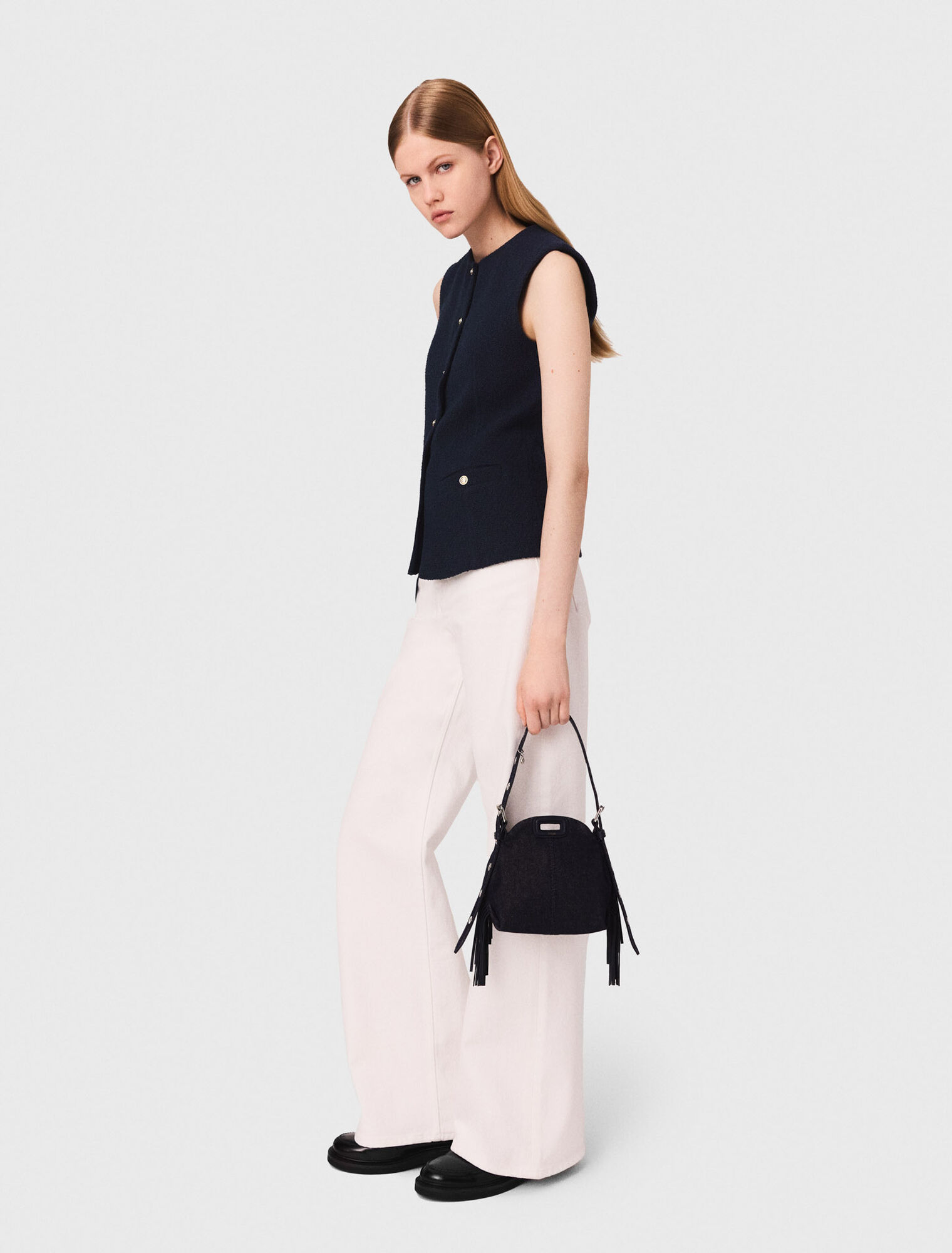 Long sleeveless tweed jacket