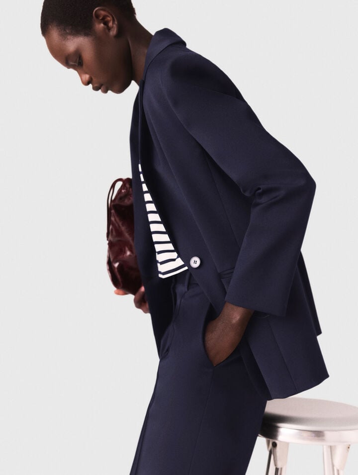Suit jacket with pleated back