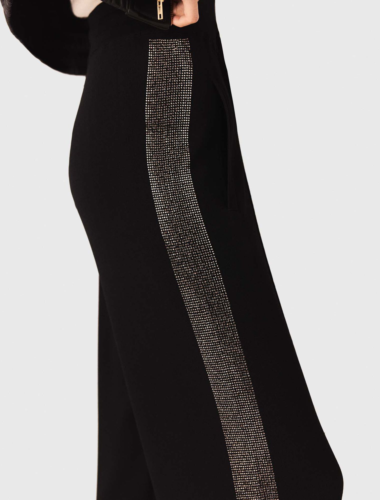 Trousers with rhinestone band