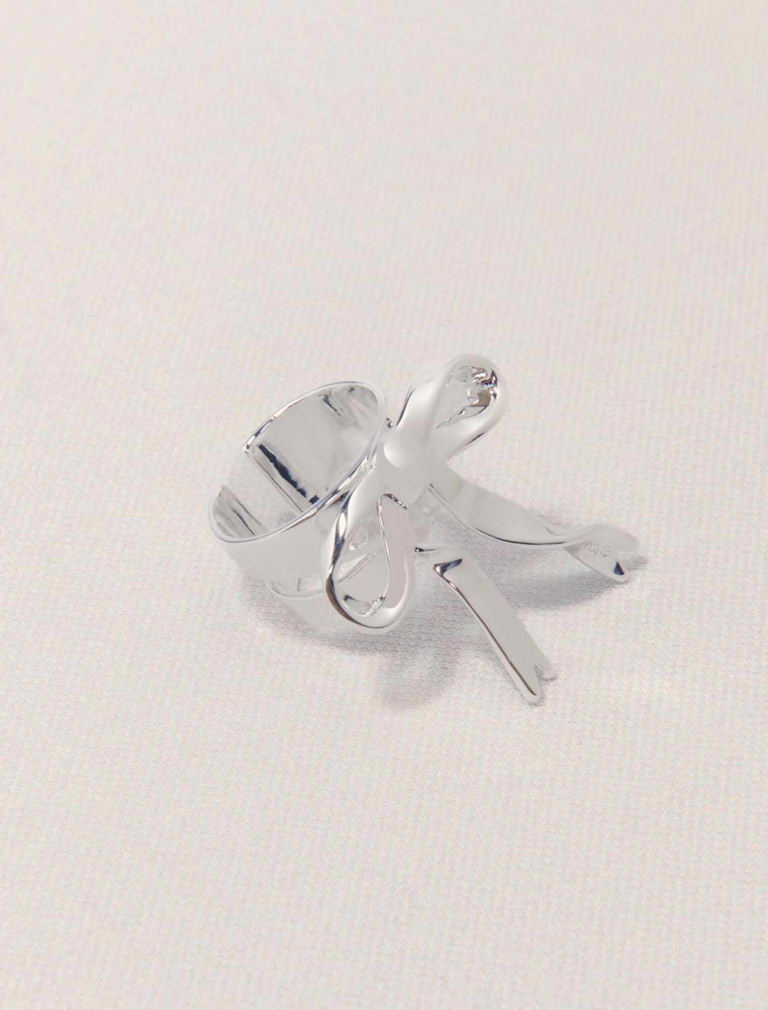 Open silver bow ring
